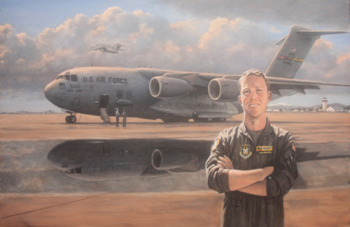 The pilot of a C-17 Globemaster poses in front of his aircraft at March AFB.